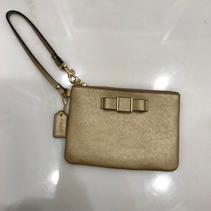 Gold coach wristlet